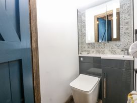 A bathroom with a toilet and sink at Windyridge in Gwaenysgor, near Prestatyn