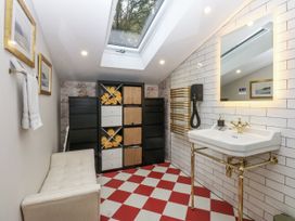 A bathroom with a sink and storage unit at Windyridge in Gwaenysgor, near Prestatyn