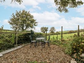 A table and chairs set in a garden at Windyridge in Gwaenysgor, near Prestatyn