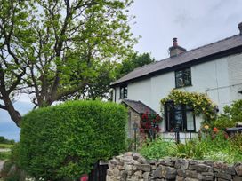 A house with a garden and trees at Windyridge in Gwaenysgor, near Prestatyn