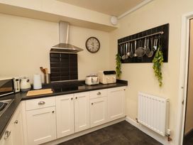 A kitchen with cooking utensils and appliances at Mallards Rest in Llandwrog near Bontnewydd, Gwynedd