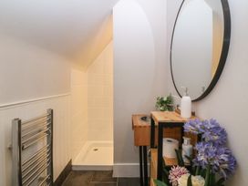 A bathroom with a towel radiator and a shower at Mallards Rest in Llandwrog near Bontnewydd, Gwynedd