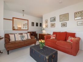 A living room with two sofas and a coffee table at 84 Fore Street