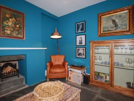 A snug with a chair and record player at 84 Fore Street