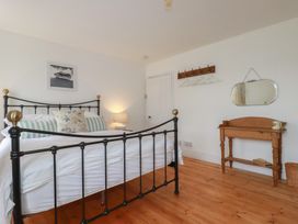 A bedroom with a bed and a table at 84 Fore Street