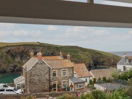 A view of houses and the coastline at 84 Fore Street