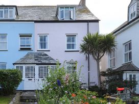 A house with a garden and flowers at 84 Fore Street Port Isaac