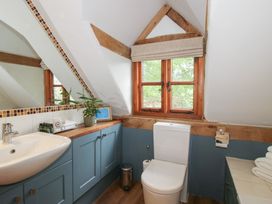 A bathroom with a sink and toilet at Pultheley Cottage Hyssington near Churchstoke