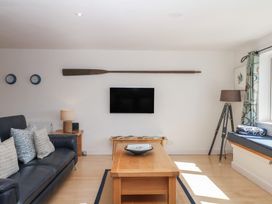 A living room with a sofa and coffee table at 4 Burgh Island Causeway in Bigbury