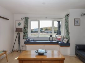 A living room with a window seat overlooking the water at 4 Burgh Island Causeway Bigbury