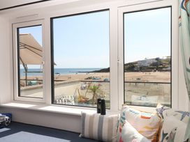 A living room with a view of the beach and sea at 4 Burgh Island Causeway Bigbury