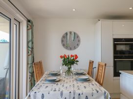 A dining room with a table and chairs at 4 Burgh Island Causeway in Bigbury
