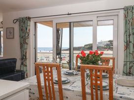 A dining room with a table set for a meal at 4 Burgh Island Causeway Bigbury