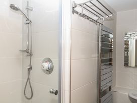 A bathroom with a shower and towel warmer at 4 Burgh Island Causeway in Bigbury