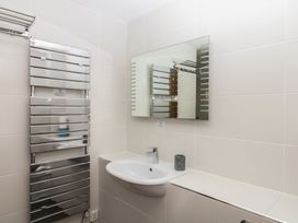 A bathroom with a sink and a mirror at 4 Burgh Island Causeway in Bigbury