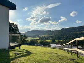 An outdoor area with grass and hills at Osprey View Lodge & Hot Tub in Aberfeldy