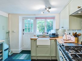 A kitchen with a sink and stove at Rivendell in Ffynnongroyw