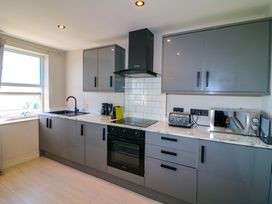 A kitchen with a sink and cooking appliances at Apt 7 @ Hunter's Quay in Bridlington