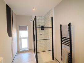 A bathroom with a shower and towel radiator at Apt 7 @ Hunter's Quay Bridlington