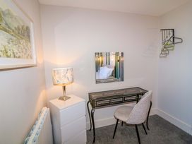 A bedroom with a desk and lamp at Apt 7 @ Hunter's Quay in Bridlington