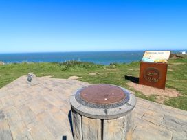 A viewing point overlooking the sea with an information board at Flamborough Head in Bridlington