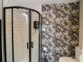 A bathroom with a shower enclosure and a toilet at Apt 8 @ Hunter's Quay, Bridlington