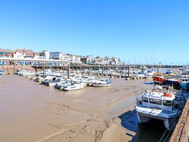 A harbor with boats and buildings at Apt 10 @ Hunter's Quay Bridlington