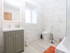 A bathroom with sink, toilet and shower at Trefor Ganol in Beaumaris