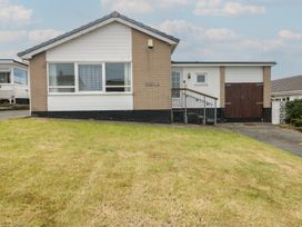 A house with a ramp and garage at 6 Gwelfor Estate