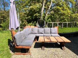 An outdoor sofa with cushions and a coffee table at Glas y Dorlan Nevern near Newport, Pembrokeshire