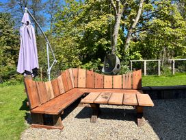 A garden with outdoor sofa and small table at Glas y Dorlan Nevern near Newport, Pembrokeshire