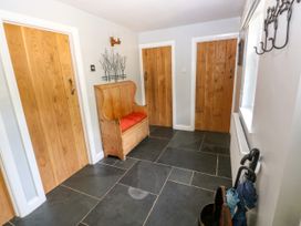 A hallway with a bench and doors at Glas y Dorlan, Nevern near Newport, Pembrokeshire