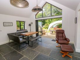 A dining room with a table and chairs at Glas y Dorlan Nevern near Newport, Pembrokeshire
