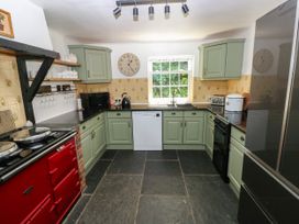 A kitchen with appliances and cabinets at Glas y Dorlan Nevern near Newport, Pembrokeshire