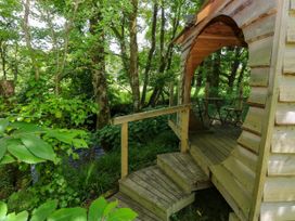 A wooden structure with a staircase and chairs at Glas y Dorlan, Nevern near Newport, Pembrokeshire