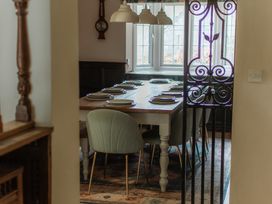 A dining room with a table set for dinner at Grey Walls in Glenridding