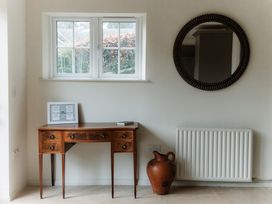 An entryway with a desk and a window at Grey Walls in Glenridding