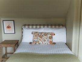 A bedroom with a bed and bedside table at Grey Walls in Glenridding