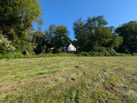A house surrounded by trees and grass at Glanduad Fawr in Newport, Pembrokeshire