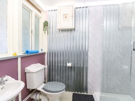 A bathroom with a toilet and sink at White Rabbit, Cross Lane, Eccles-On-Sea