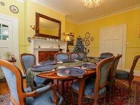 A dining room with a table set for dinner at White House