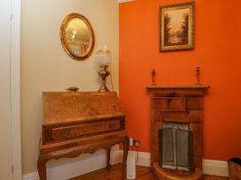 A living room with a writing desk and fireplace at White House