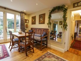 A dining room with a table and chairs at White House