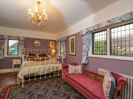 A bedroom with a bed and sofa at White House