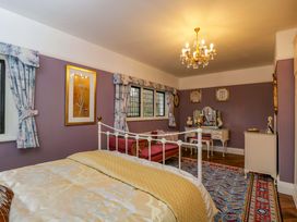 A bedroom with a bed and dresser at White House