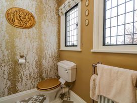 A bathroom with a toilet and windows at White House