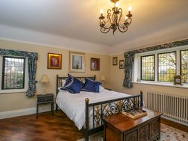 A bedroom with a bed and bedside table at White House