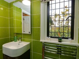 A bathroom with a sink and mirror at White House