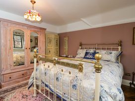A bedroom with a bed and wardrobe at White House