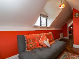 A living room with a sofa and window at White House